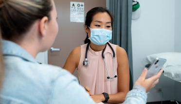 Photo: patient showing doctor phone