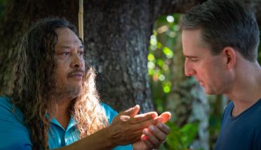 Kuku Yalanji man Linc Walker shows local bush medicine to Port Douglas pharmacist Brad Reilly