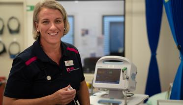 Nurse in hospital taking observations