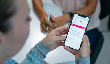 Lady viewing her phone with her My Health Record on screen