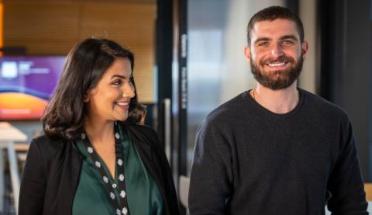 A young male and female ADHA employee pose.