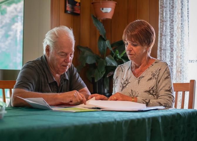 Photo: man and woman looking at paperwork
