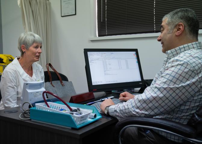 Photo: woman at a doctor's consultation