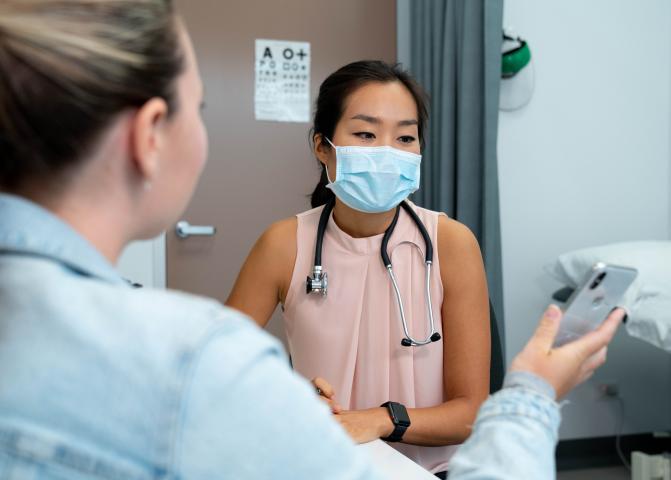 Photo: patient showing doctor phone