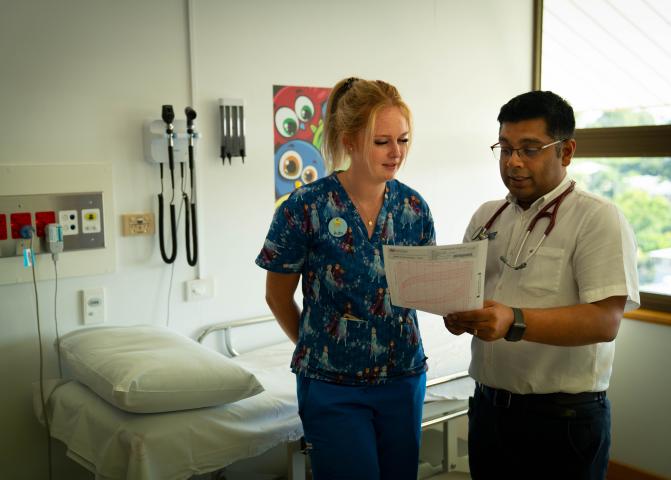 Nurse and doctor looking over a patient chart