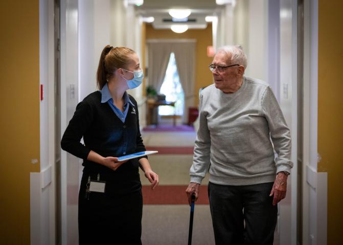 Aged care worker with old man