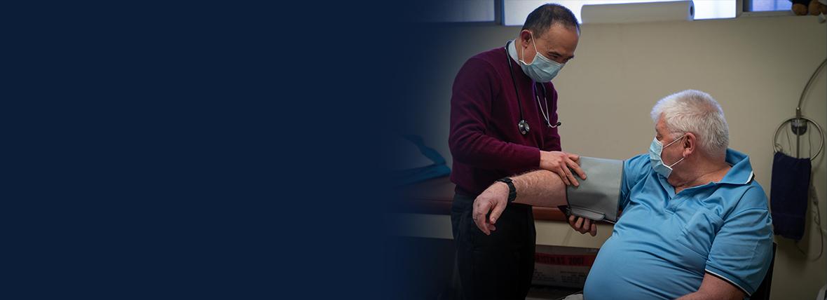 Doctor taking a patient's blood pressure