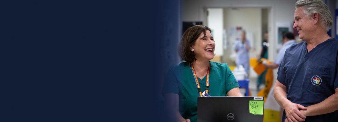 Two healthcare providers in a hospital setting