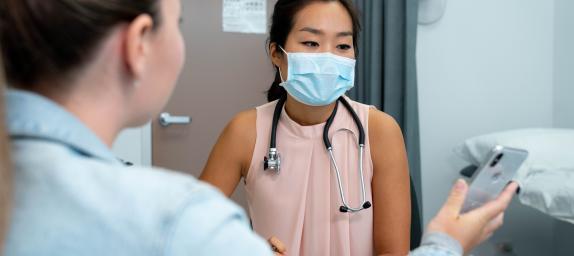 Photo: patient showing doctor phone