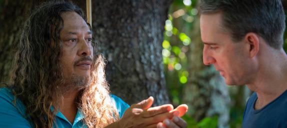 Kuku Yalanji man Linc Walker shows local bush medicine to Port Douglas pharmacist Brad Reilly