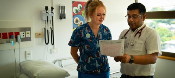 Nurse and doctor looking over a patient chart
