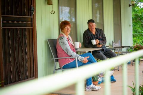 Photo: woman and man having tea