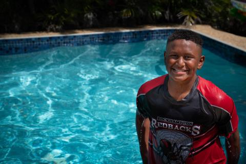 Teen boy by a pool