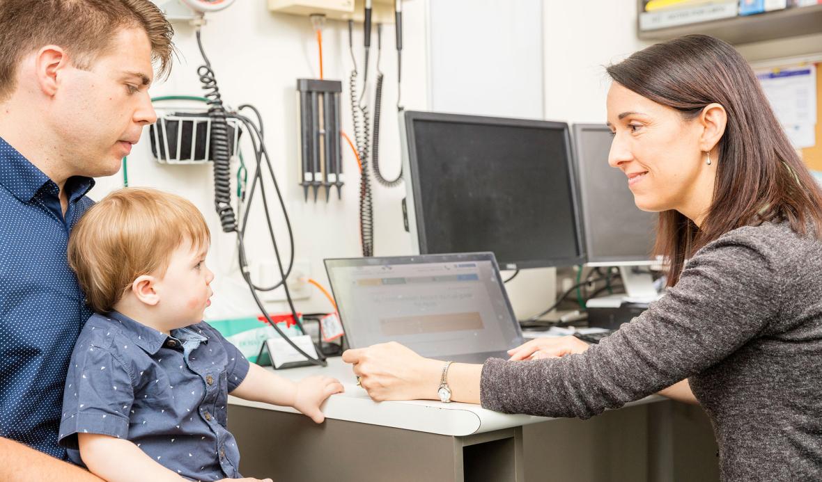 Man and child at doctor consultation