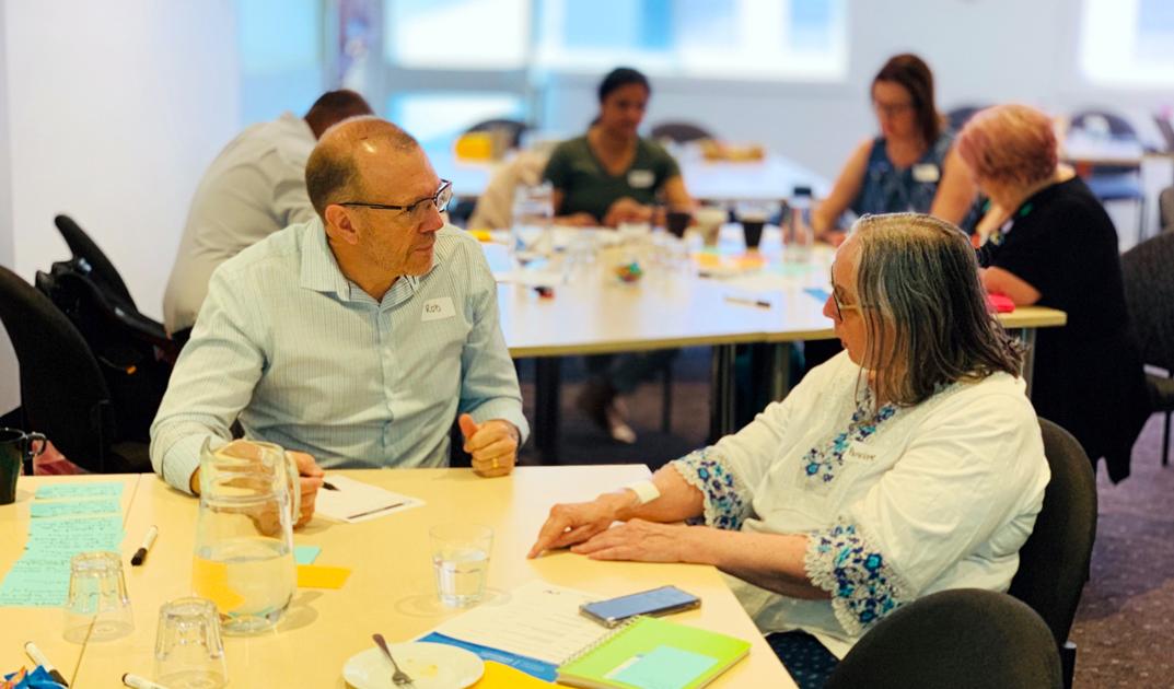 Agency Clinical Reference Lead, Rob Moore, in discussion with a workshop participant