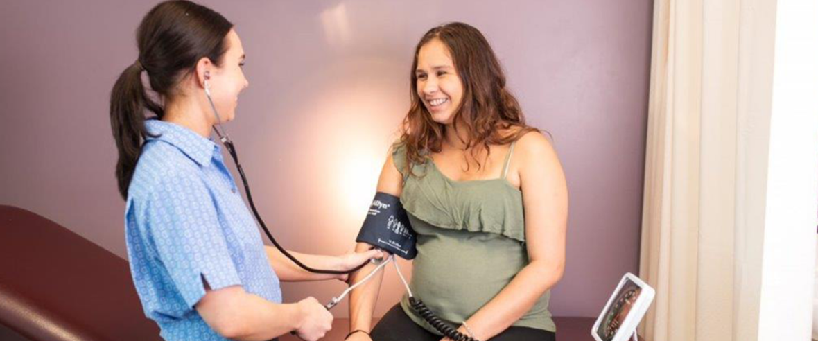 Pregnant woman at consultation