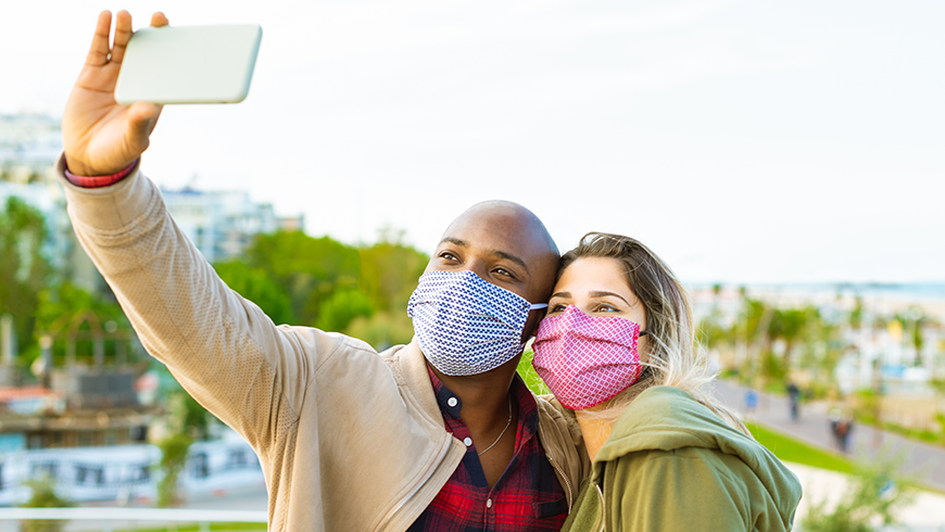 Photo: man and woman taking a selfie