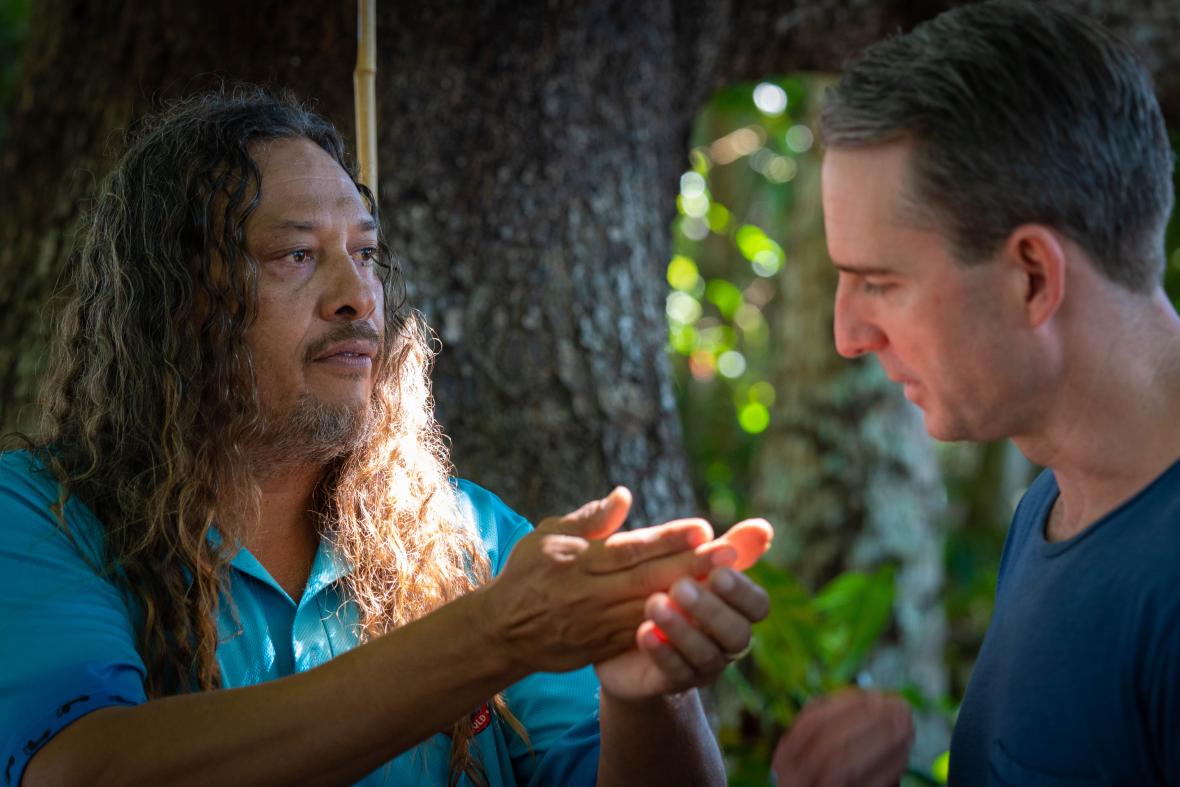 Kuku Yalanji man Linc Walker shows local bush medicine to Port Douglas pharmacist Brad Reilly