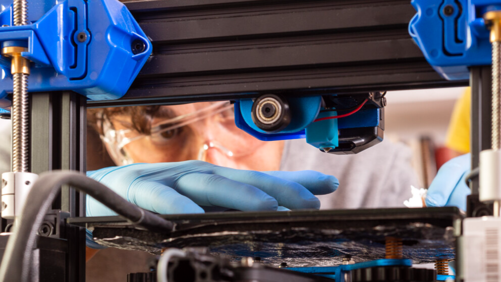 Person using 3D printer