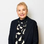 A portrait of Ms Lyn McGrath.