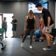 A woman and man workout in a gym